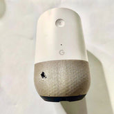 Google Home device promotional torn with original power adopter